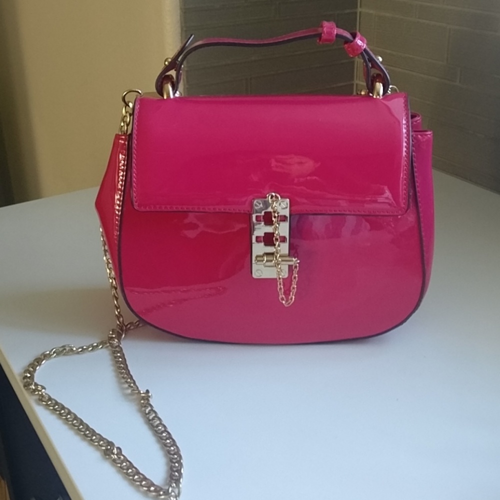 Pink patent faux leather crossbody bag purse